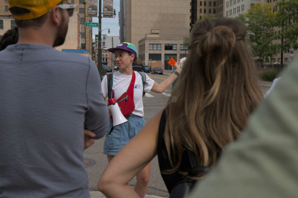 Tess Parr points toward the former United Artists Theater during the process of demolition for surface parking.