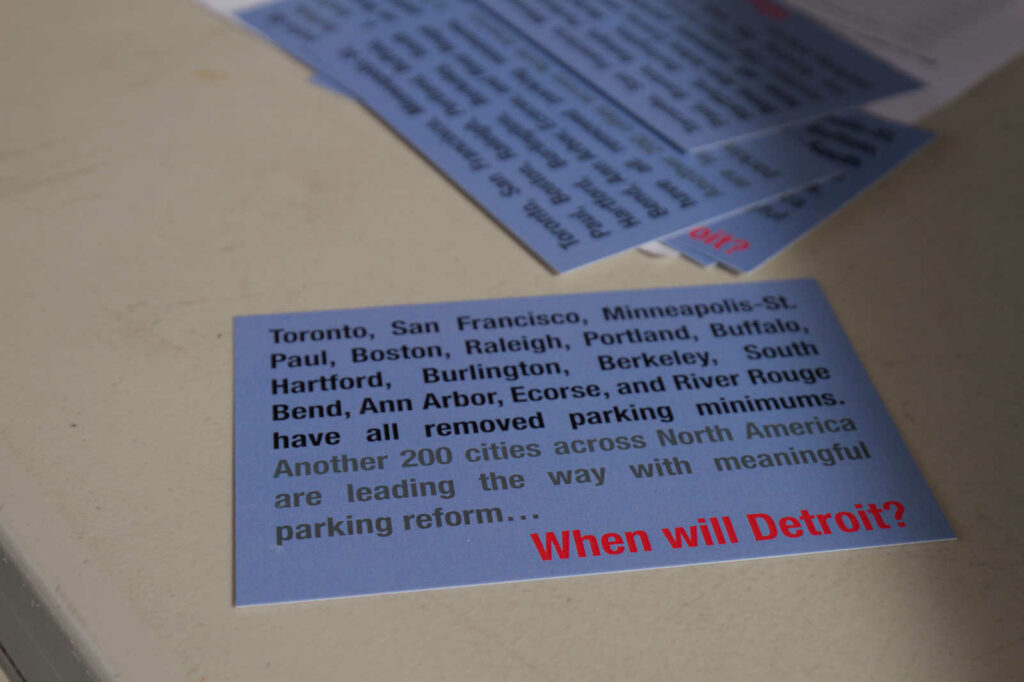 A photograph of a postcards to be sent to Detroit elected officials asking when Detroit will take up parking reform.