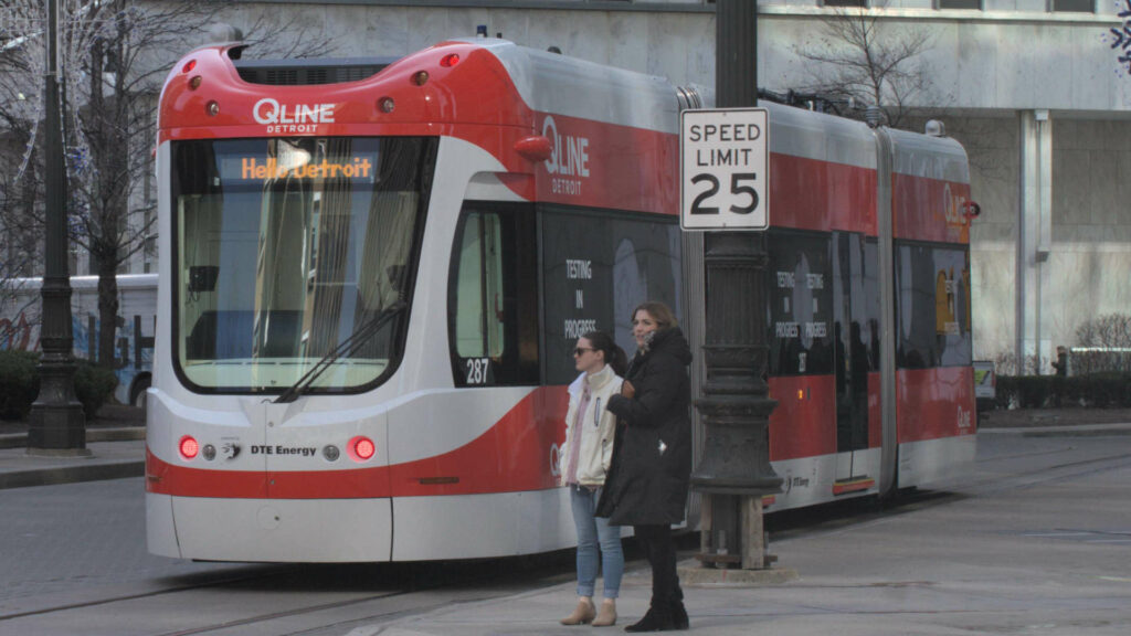 A QLine streetcar travels up Woodward Avenue.